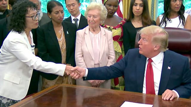 U.S. President Donald Trump shakes hands with Ms. Zhang Yuhua, a Falun Gong practitioner who survived persecution in China, at the White House on July 17, 2019. (Screenshot/The White House)